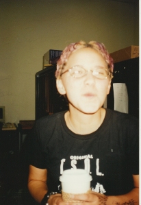 My College Rebellion of purple hair, punk rock band t-shirt, coffee, and henna tattoos. While making a funny face.